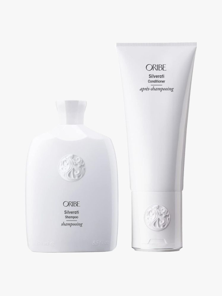 Oribe Silverati Shampoo and Conditioner in branded components on a light gray background